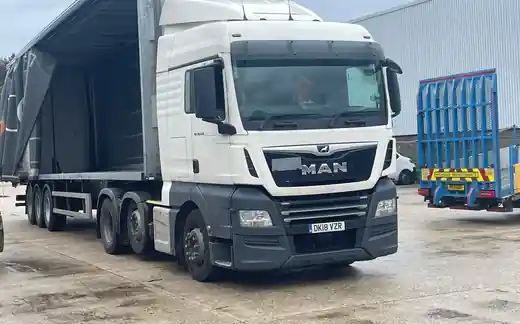 MAN TGX with curtainsider trailer loading at the Avonmouth yard